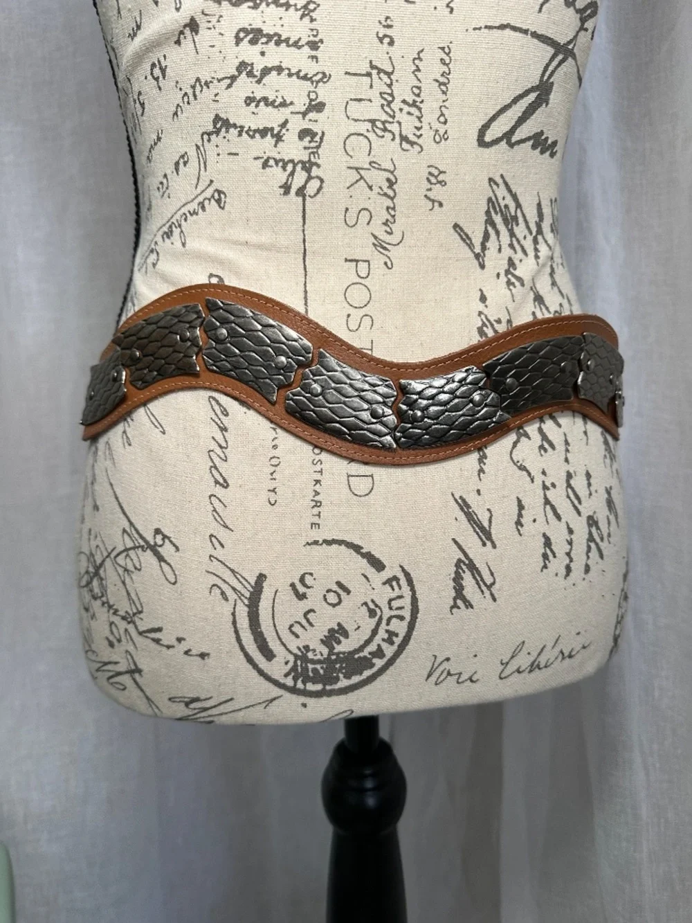 Vintage brown leather and silver colored metal articulated snake belt
